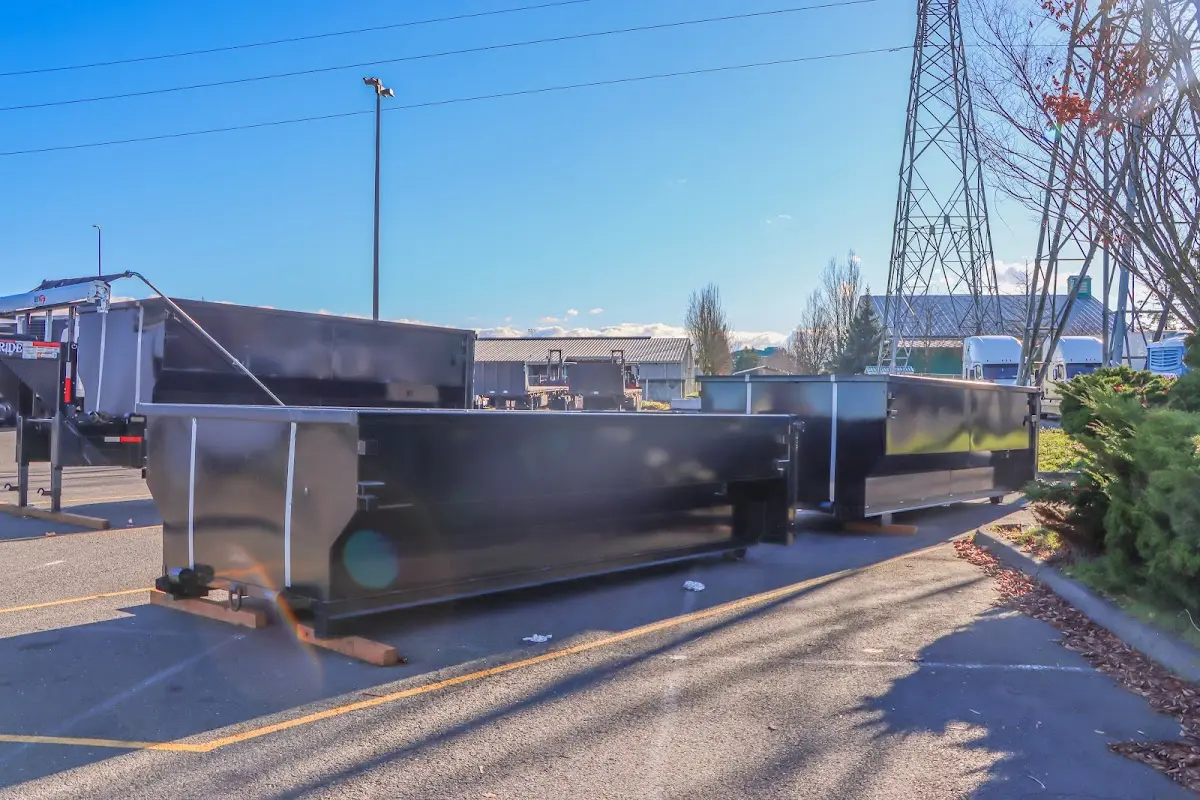 Roll-off dumpster ready for waste disposal at job site for Construction Dumpster Rental in Hampden
